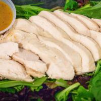 Kmg Lean · Poached juicy chicken breast over spring mix salad with cucumber and cilantro served with mo...