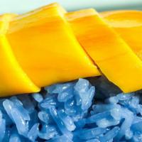 Khao Neow Ma Muang · Sliced mango with sticky rice and coconut.
