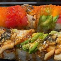Dragon Roll · In - shrimp tempura, avocado and our krab salad. Out - unagi eel, sesame seeds and our angui...