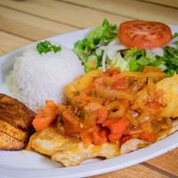 Lomo De Cerdo A La Criolla · Grilled pork sirloin served with yucca root, potatoes, rice, salad and sweet plantains.