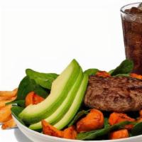Paleo Burger Combo · Single patty served in a bowl with Diced Sweet Potatoes and Avocado on a bed of Baby Spinach...