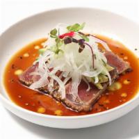 Tuna Tadaki · Sesame coated seared thin sliced tuna with thinly sliced onion, micro greens, ponzu. Consumi...