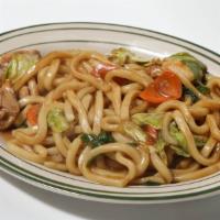 Yaki Udon · Stir-fried udon noodles with mixed vegetables with bonito flakes on top. Choice of seafood, ...