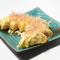 Mendaiko Tamago Yaki · Egg omelet with cod fish roe with mayo topped with bonito flakes.