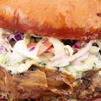 Blue Goat · House-ground beef patty, bleu cheese slaw, caramelized onions, bleu cheese crumbles, garlic-...