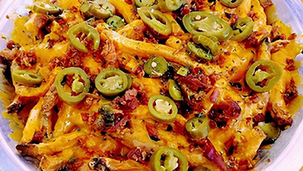 Cheese Fries Surprise · A large serving of Hand Punched Fries, topped with cheddar, bacon, jalapeños and (surprise!) our homemade chili - served with ranch and ketchup