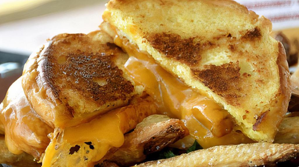 Grilled Cheese Sandwich · A grilled cheese sammy on a toasted brioche bun