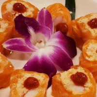 Rose Roll · Spicy crab meat and shrimp wrapped with soy paper and salmon.