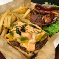 Cheddar Jalapeño Bacon Burger · This local favorite has cheddar cheese, jalapeños, bacon, and homemade spicy mayo.