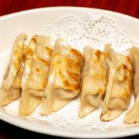 Gyoza (5Pcs) · Pan fried dumplings served with ponzu sauce.