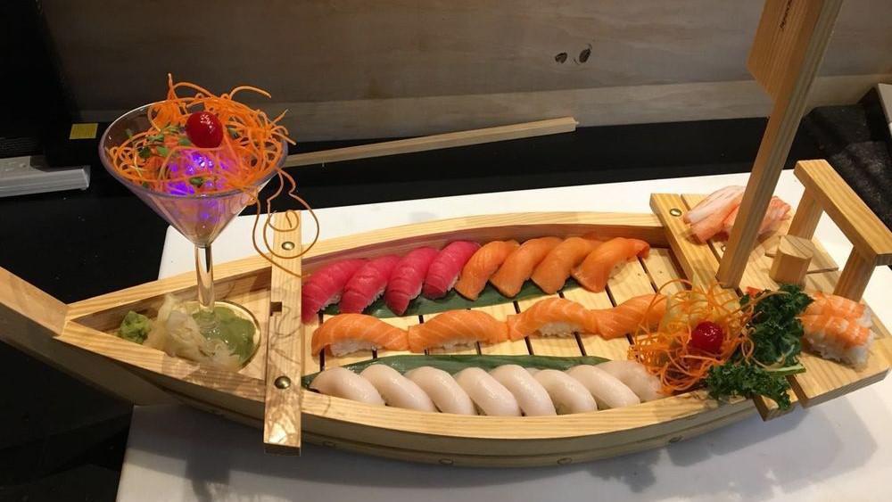 Kyoto Love Boat · 10 pcs chef’s choice sushi,10 PCs chef’s choice sashimi,eel roll, salmon roll,tuna roll,rainbow roll in big party tray(value $95)