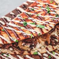 Brisket Quesadilla · Chipotle-Brown Sugar Braised Brisket, Caramelized Onions & Cheddar Cheese with BBQ, Sour Cre...