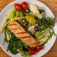 Greek Salmon Salad · Grilled Atlantic Salmon filet on a large Greek salad.