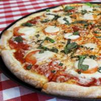 18In Margherita Pizza · Fresh-sliced tomatoes, basil, mozzarella  cheese, and extra virgin olive oil over marinara s...