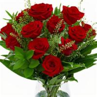 Unforgettable Arrangement (Red) · A Dozen Red Roses with greenery and filler in a clear vase.