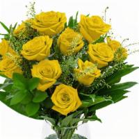 Unforgettable Arrangement (Yellow) · A Dozen Yellow Roses with greenery and filler in a clear vase.