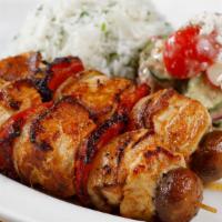 Grilled Chicken Kebabs · Marinated grilled chicken served over cilantro rice and paired with a cucumber & feta salad