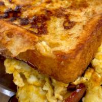 French Toast Sandwich  · Turkey Bacon, and two eggs any way; sandwiched between two French toast slices.