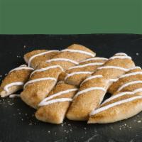Cinnamon Sticks · The name says it all. Our freshly baked breadstix topped with cinnamon, sugar and drizzled w...