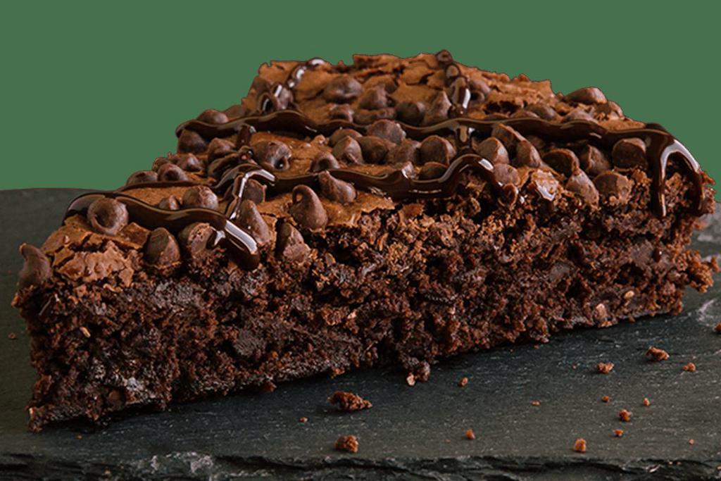 Ultimate Brownie Slice · This piece of chocolate heaven is a delicious brownie with extra chocolate chips and chocolate sauce. It’s a chocolate lover’s dream.