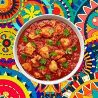 Coastal Chicken Vindaloo · A special from the coastal state of Goa, boneless morsels of chicken, slow cooked in a hot a...