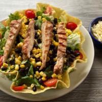 Grilled Fajita Salad · Mesquite grilled chicken or steak served in a tortilla shell with lettuce, topped with fresh...