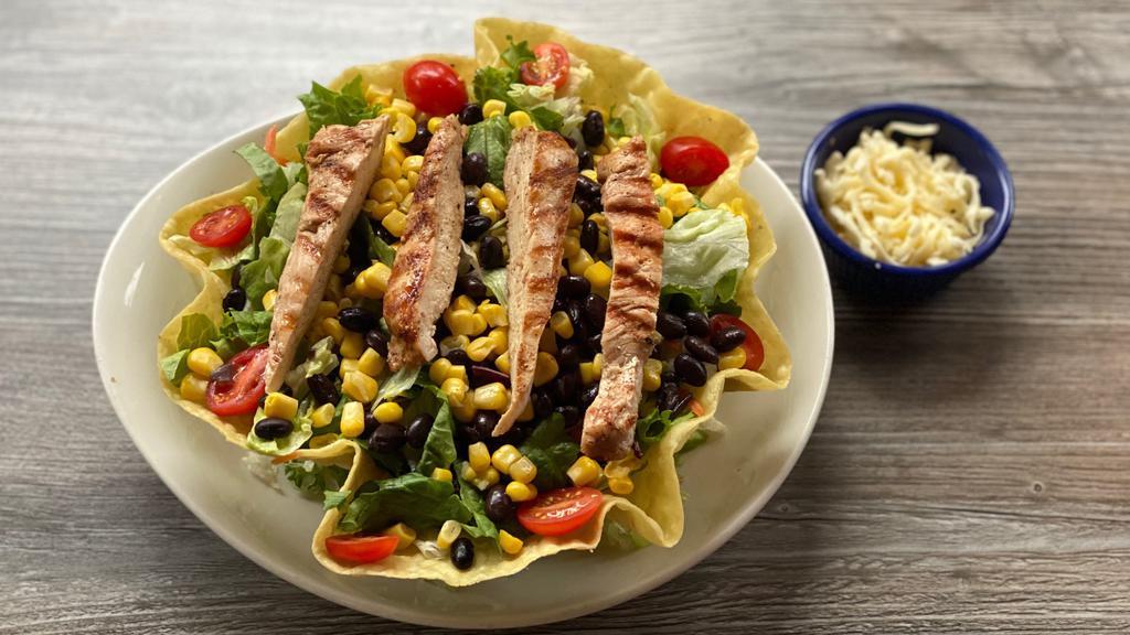 Grilled Fajita Salad- Chicken · Mesquite grilled chicken fajita served in a tortilla shell with lettuce, topped with fresh tomato.