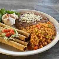 Chicken Flautas · 4 Texas-Sized flautas served with Spicy Sundance Queso, sour cream, and sided by beans and r...
