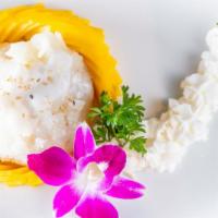 Sticky Rice With Mango · Lightly sweetened sticky rice warmed in coconut milk. Served with fresh mango slices.