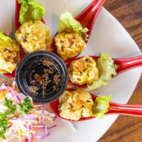 Thai Dumplings · Minced chicken and pork wrapped in wontons then steamed served with our homemade soy sauce.