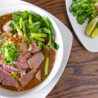 Thai Boat Noodle Soup · Beef, brisket, meatball, tripe in a thai beef stewed soup. Your choice of vermicelli or smal...