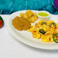 Huevos A La Mexicana / Eggs Mexican Style · Huevos revueltos con cebollas, tomates y jalapeños, servidos con frijoles refritos y papas. ...