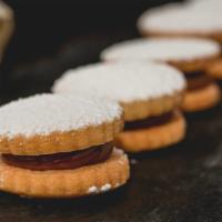 Alfajores · Six of our famous home-made dulce de leche sandwich cookies.