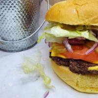 Big Tex Burger · Single Pattie Angus Chuck Beef, Mayo, Mustard, Lettuce, Tomatoes, Onions, Pickles.
