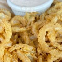 Onion Strings  · Thinly sliced &  hand battered, served with a side of spicy ranch.