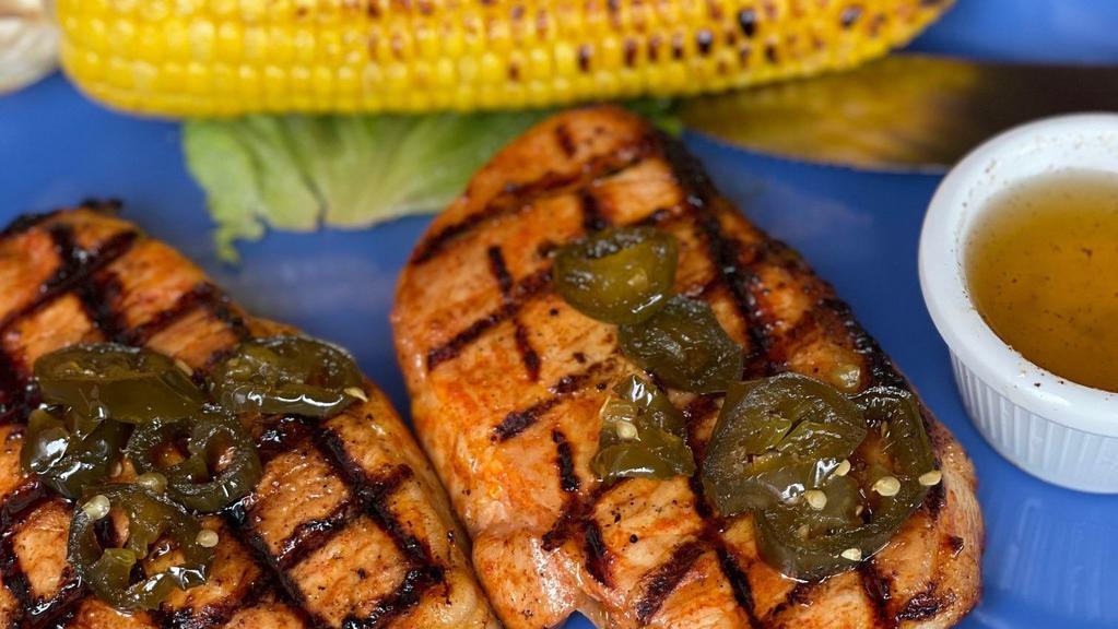 Bandera Pork Chops · with roasted corn on the cob, Two pork chops with a sweet & spicy jalapeno glaze (Gluten-Free)