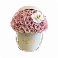 Eskimo Roses & White Orchids In A Box · Eskimo roses with their pastel shades and an amazing shine symbolize elegance and serenity. ...