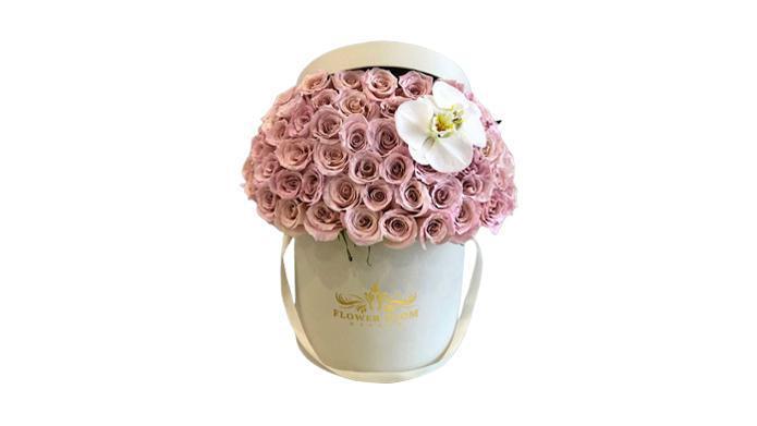 Eskimo Roses & White Orchids In A Box · Eskimo roses with their pastel shades and an amazing shine symbolize elegance and serenity. Absolutely beautiful & elegant arrangement for her.