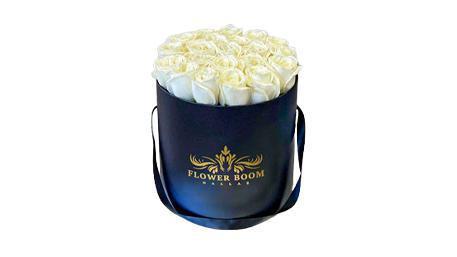 Amelie White Rose Box · White roses are traditionally associated with marriages and new beginnings, but their quiet beauty has also made them a gesture of remembrance. This modern design of Fbd Amelie White Rose Box will amaze its owner. About 20-25 fresh white roses are beautifully and carefully aligned next to each other creating the bed of roses on a single plane.