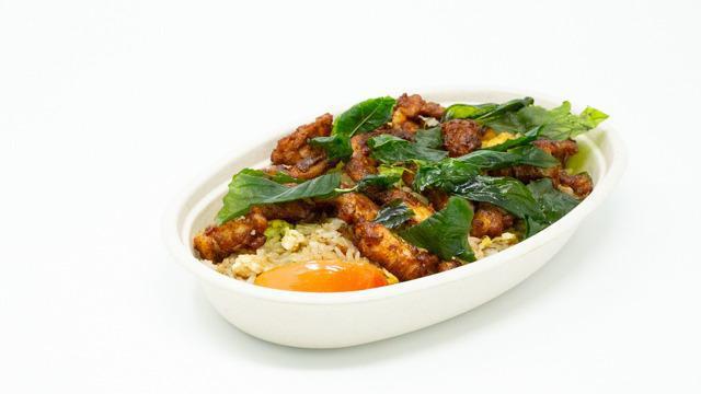 Herbal Chicken Fried Rice · Stir-fried rice with a special blend of seasoning topped with our delicious herbal chicken.