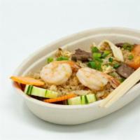Combination Fried Rice · Stir-fried rice with chicken, beef, shrimp, onions, tomatoes, and egg.