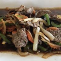 Pepper Steak · Tender beef slices sauteed with sweet onions carrots scallions and bell pepper in a tangy sp...