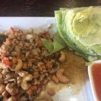 Thai Chicken Lettuce Wrap · A wrap served with lettuce, cilantro, and pineapple sauce chicken or tofu pan tossed with sc...