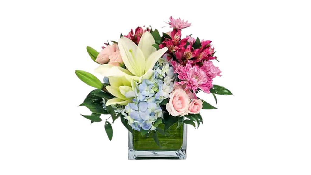 Soothing Surroundings · Soothing shades of blue, white, light pink and lavender flowers are designed in a square glass vase. This arrangement is perfect for a desk or end table.

Approx. 11