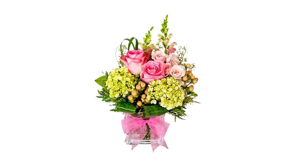 Pretty In Pink · Arrangement consisting of green mini hydrangea, pink roses, peach hypericum, and pink snaps.

Approx. 12