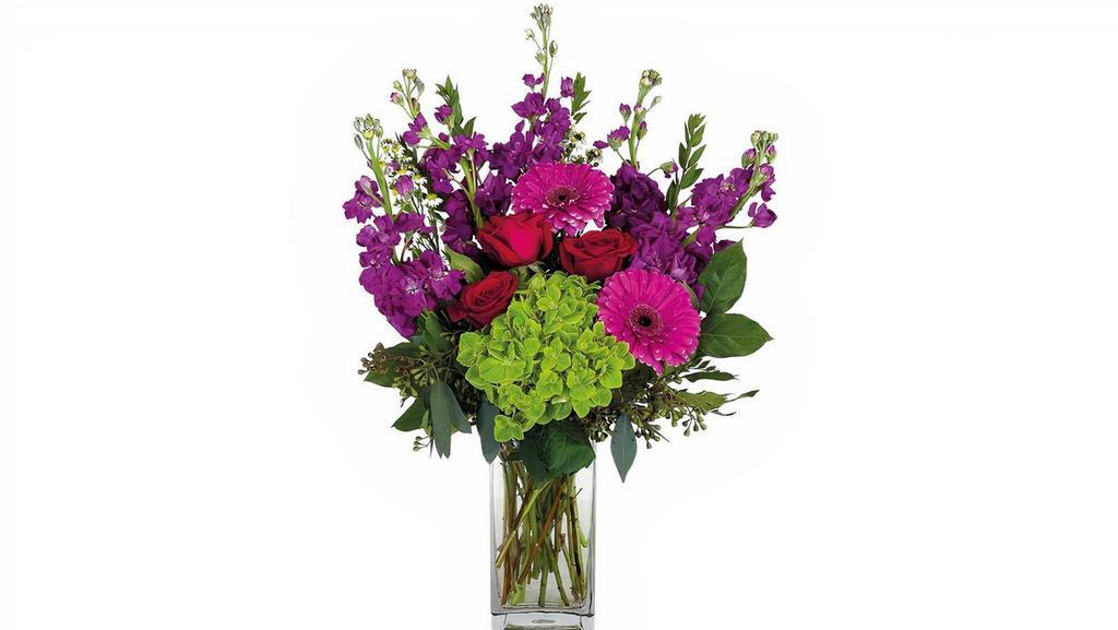 Lovey Deluxe · Share the happy with the deluxe version of our Lovey arrangement. Red roses, gerbera daisies, stock and hydrangea will look so lovely on a desk or coffee table.

Approx. 15