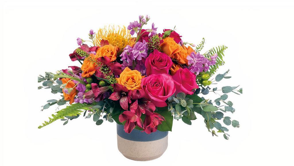 Hanna All Around · Share this sweet arrangement for any occasion! The Pincushion proteas bring that uniqueness to this joyful arrangement. The lush mixture of foliage creates a perfect nest for our Ecuadorian roses, fragrant stock and Peruvian lilies. 

All around: 14