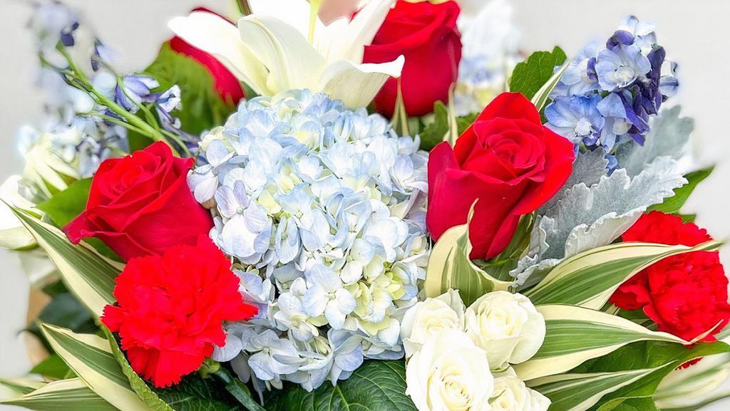 Designers Choice - Standard · Let our talented designers create a custom floral arrangement just for you! Each arrangement will be handcrafted using the freshest flowers in seasonal colors.