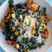 Crispy Chicken Kale Caesar Salad · tuscan kale, romaine hearts, cabbage, corn nuts, & parmesan cheese with classic caesar dress...