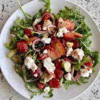 Strawberry Watermelon Salad · [new] goat cheese, arugula, cucumber, shaved red onion, mint,lime vinaigrette, & tajin